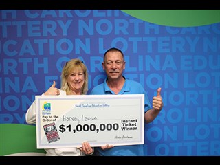 NCEL photo - Harvey Lawson and his fiancé, Pam Jarrell, celebrate the win with the “Big Check.”
